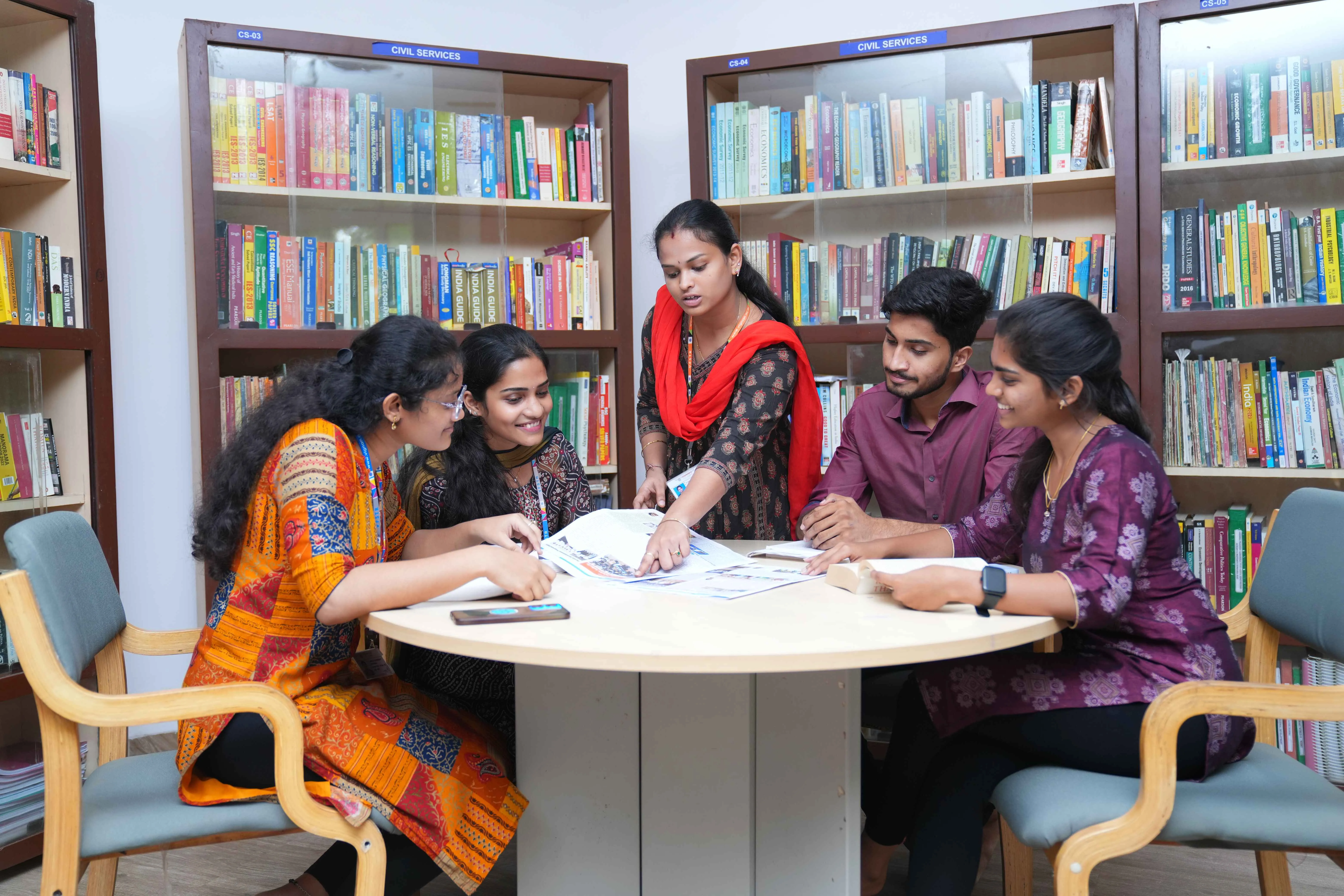 Students collaborating around a table in the Idea Hub