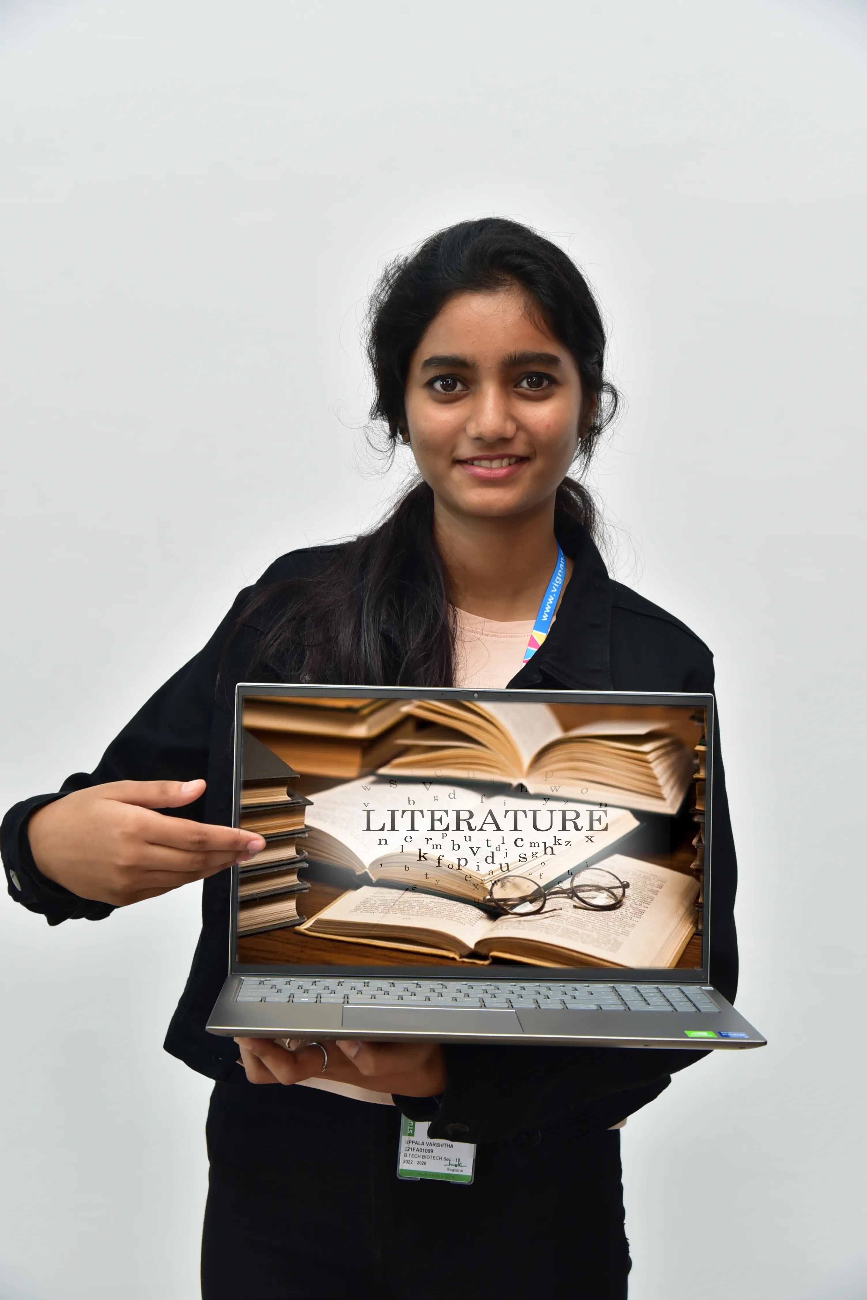 Student presenting literature work on a laptop